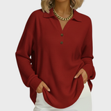 Rotbrauner Pullover mit Kragen, Knopfleiste und langen Ärmeln.